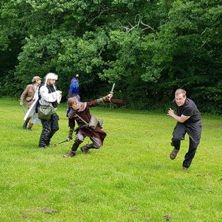 A human scout dramatically dodges an incoming monster. A human scout dramatically dodges an incoming monster.